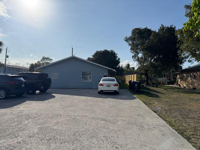 view of home's exterior with fence