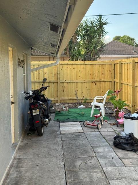 view of patio / terrace featuring fence