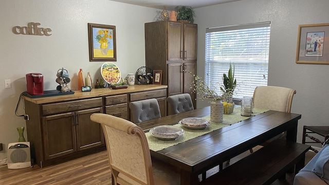 dining room with wood finished floors