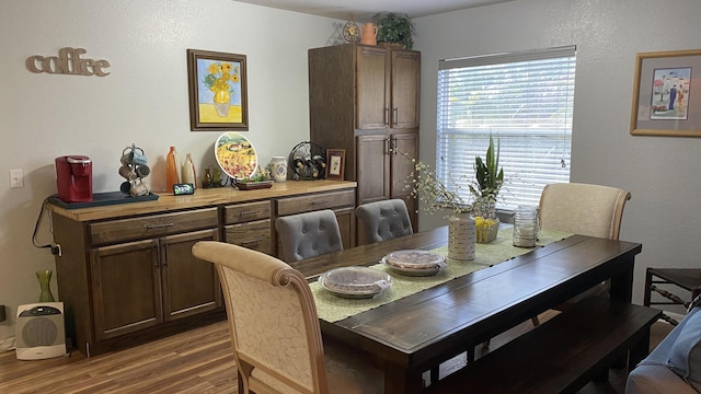 7 Los Lagos Ln, Port Saint Lucie, FL 34952 - dining room featuring wood finished floors and a textured wall