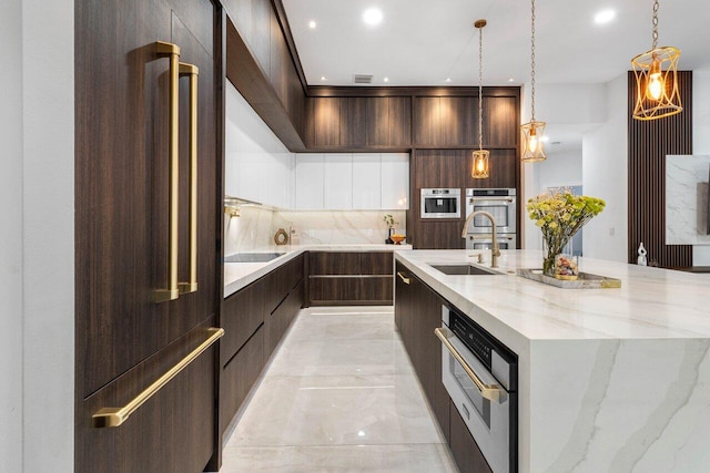 kitchen featuring a sink, dark brown cabinets, a large island, backsplash, and modern cabinets