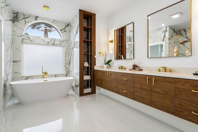 full bath with a freestanding bath, a sink, and double vanity