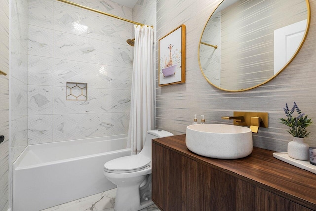 bathroom with toilet, marble finish floor, shower / tub combo, and vanity