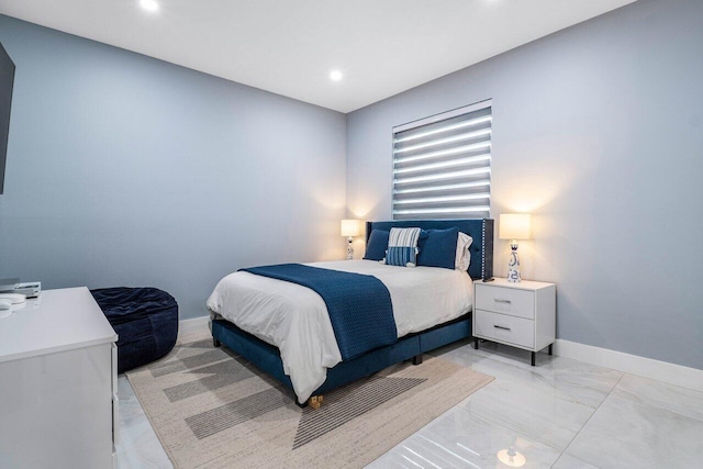 bedroom featuring baseboards and recessed lighting