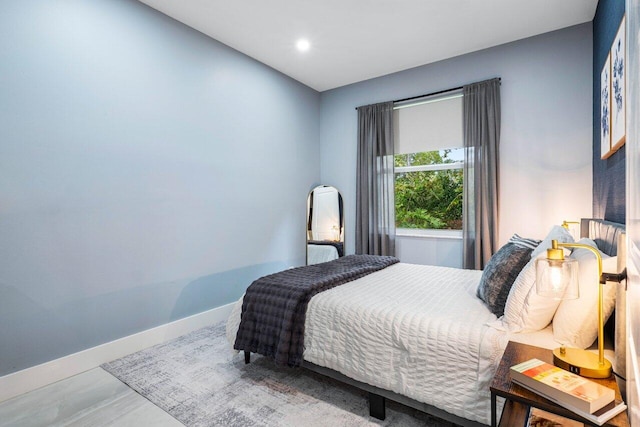 bedroom featuring baseboards and recessed lighting