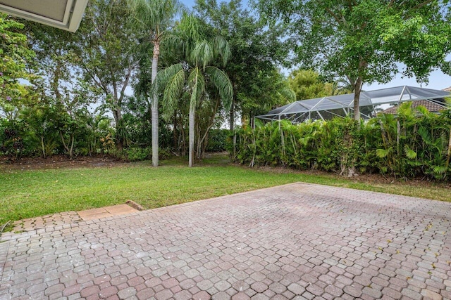 view of patio / terrace featuring a lanai