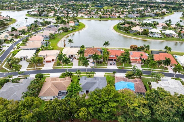 bird's eye view featuring a water view and a residential view