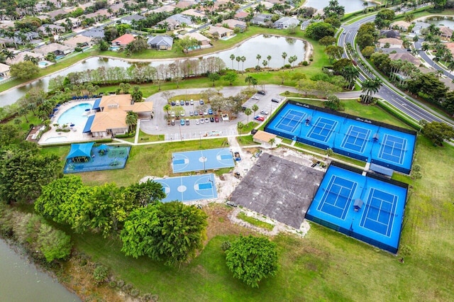 birds eye view of property with a residential view and a water view