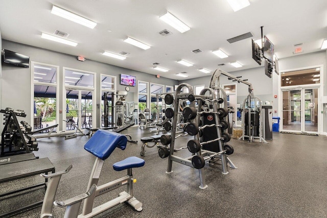 gym featuring french doors and visible vents