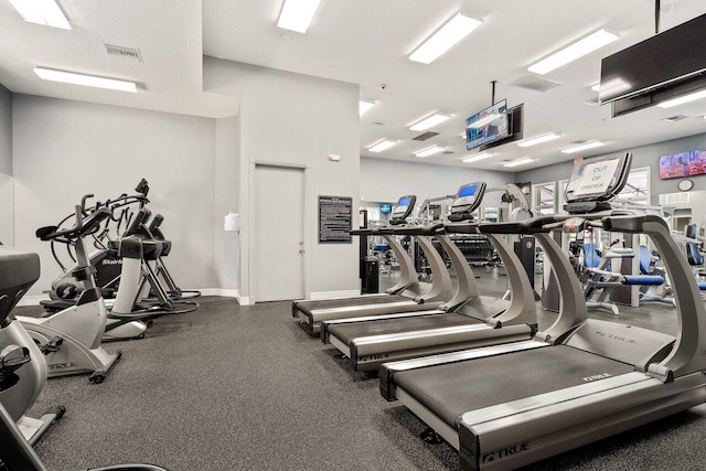 gym featuring visible vents and baseboards