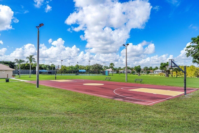 view of sport court with community basketball court and a lawn