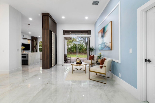 sitting room featuring marble finish floor, recessed lighting, visible vents, and baseboards