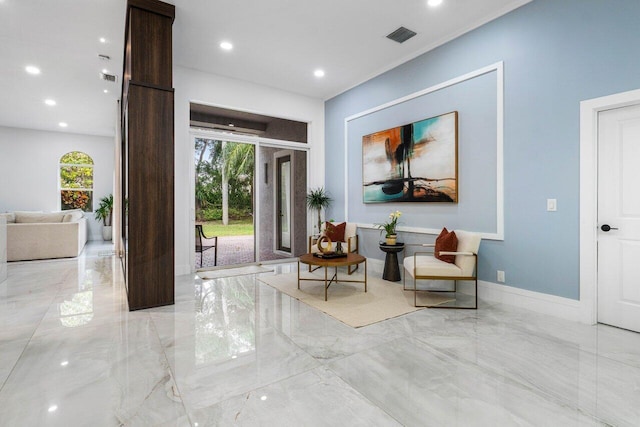 living area with marble finish floor, baseboards, visible vents, and recessed lighting