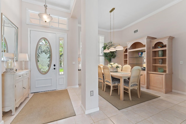 entryway featuring light tile patterned floors, baseboards, visible vents, and ornamental molding