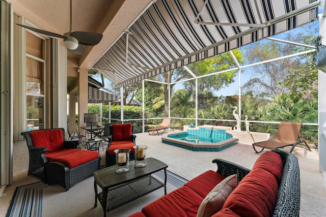 view of patio / terrace featuring a lanai, an outdoor pool, outdoor lounge area, and a ceiling fan