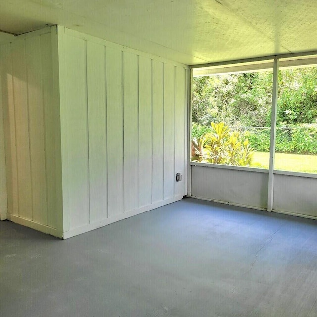 unfurnished sunroom with a wealth of natural light