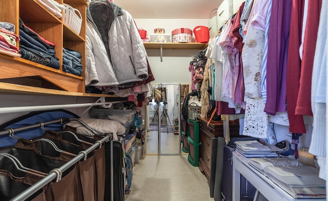 spacious closet featuring light tile patterned flooring