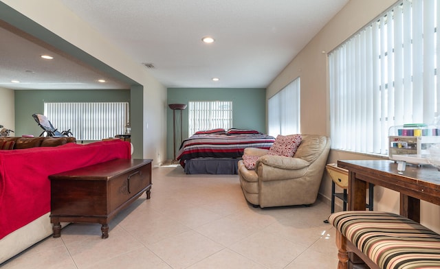 bedroom with tile patterned flooring, visible vents, and recessed lighting