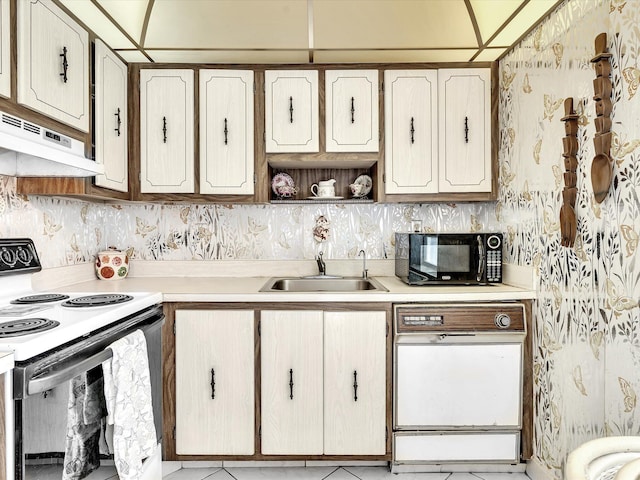 kitchen featuring white electric range oven, a sink, black microwave, dishwasher, and under cabinet range hood