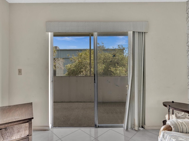 doorway to outside featuring light tile patterned floors