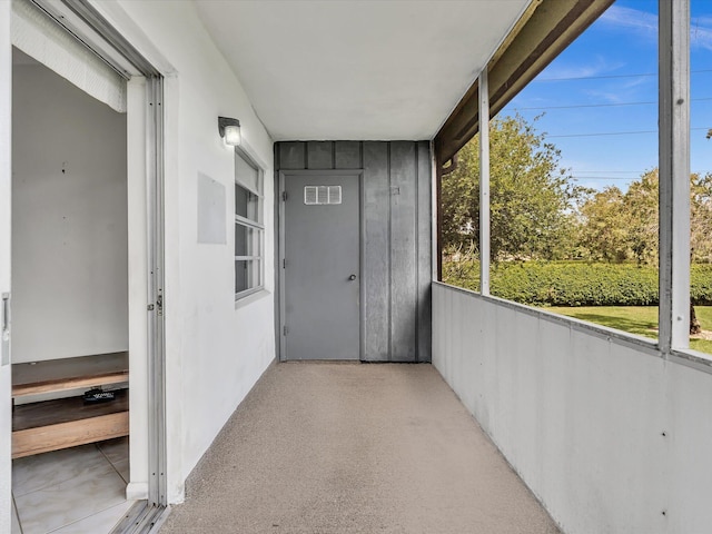 unfurnished sunroom with visible vents