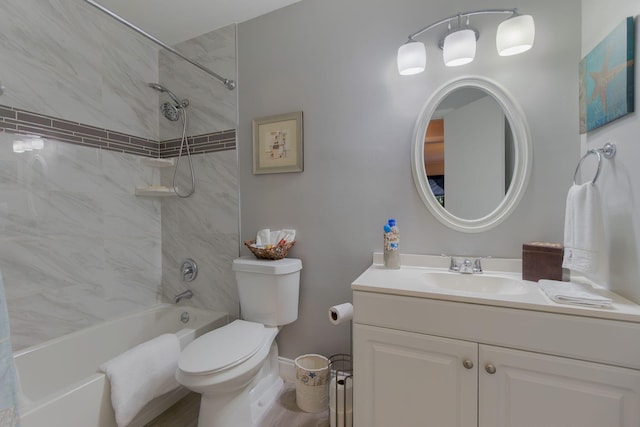 bathroom featuring bathing tub / shower combination, toilet, and vanity