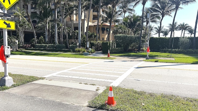 view of street with sidewalks and traffic signs