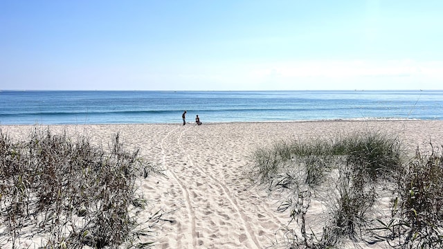 view of water feature with a beach view