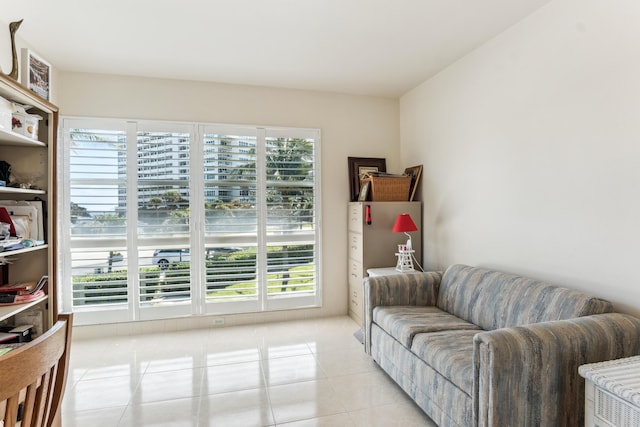 living area with a healthy amount of sunlight and light tile patterned floors