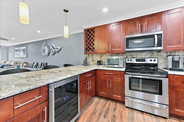 kitchen featuring wine cooler, a toaster, stainless steel appliances, tasteful backsplash, and crown molding