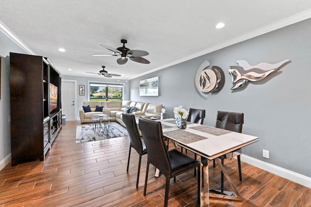 dining space with ornamental molding, recessed lighting, baseboards, and wood finished floors