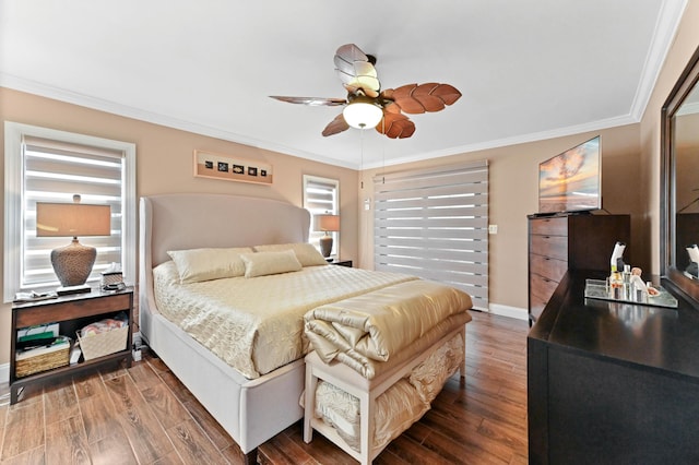 bedroom with ornamental molding, dark wood-style flooring, a ceiling fan, and baseboards