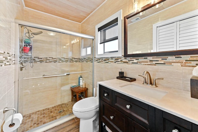 full bathroom with toilet, a shower stall, backsplash, and vanity