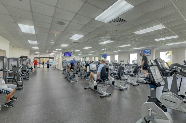 workout area featuring visible vents and a paneled ceiling