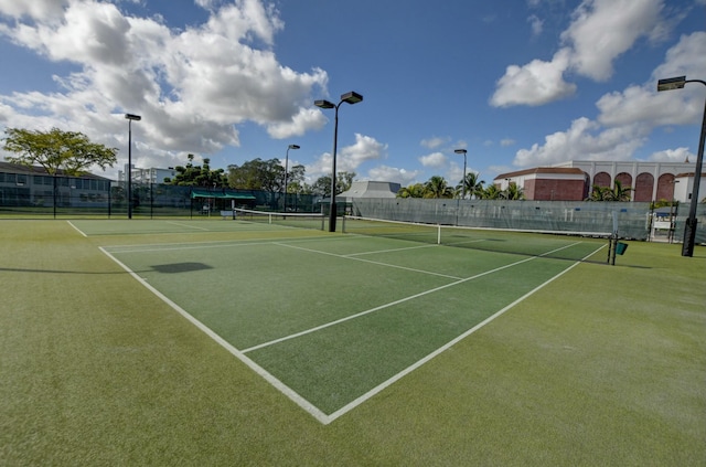 view of sport court with fence