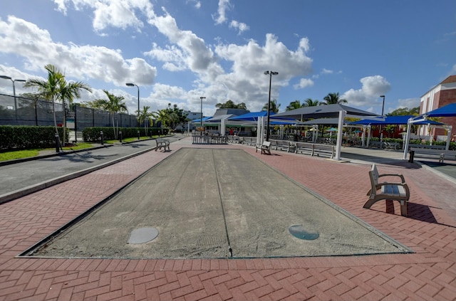 view of community featuring fence