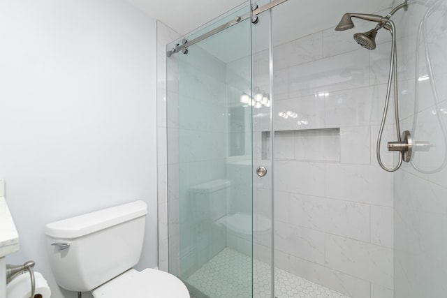 full bath with a shower stall and toilet