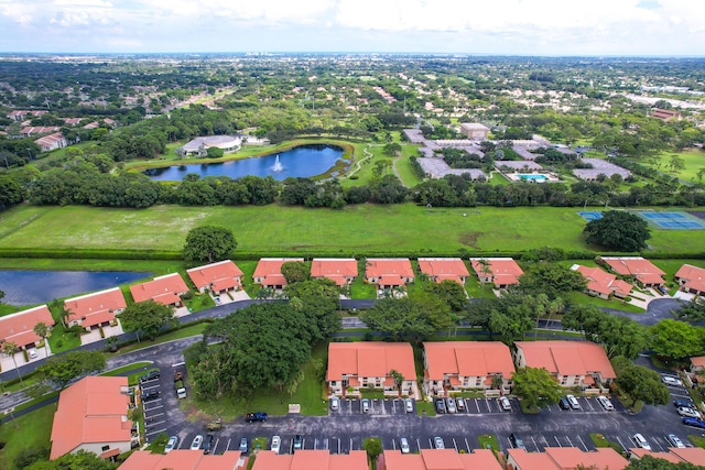 birds eye view of property with a residential view and a water view