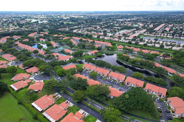 bird's eye view featuring a water view and a residential view