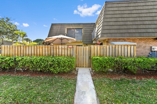 view of yard with fence and a gate