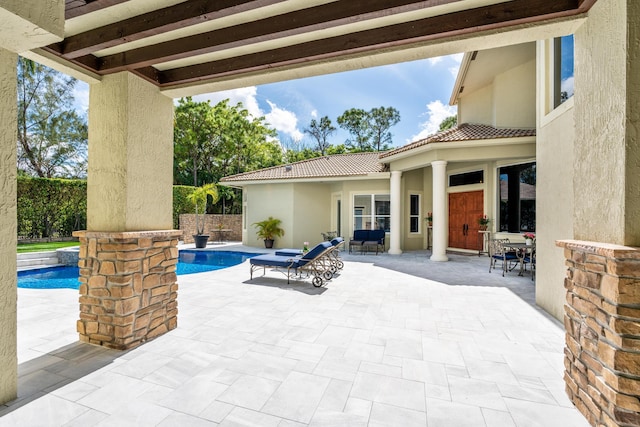 view of patio with an outdoor pool