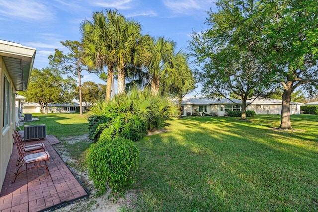 view of yard featuring central AC