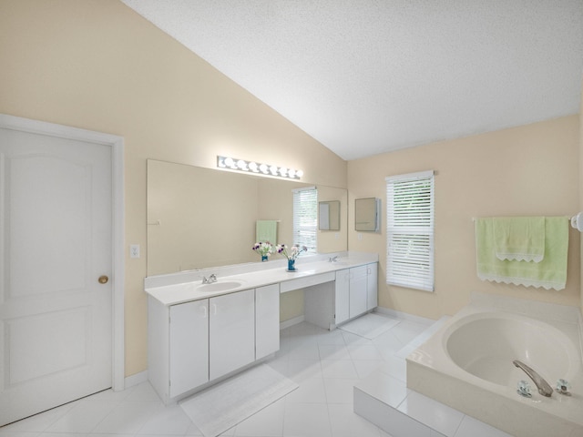10282 Hunt Club Ln, Palm Beach Gardens, FL 33418 - full bath featuring vaulted ceiling, double vanity, a garden tub, a textured ceiling, and baseboards