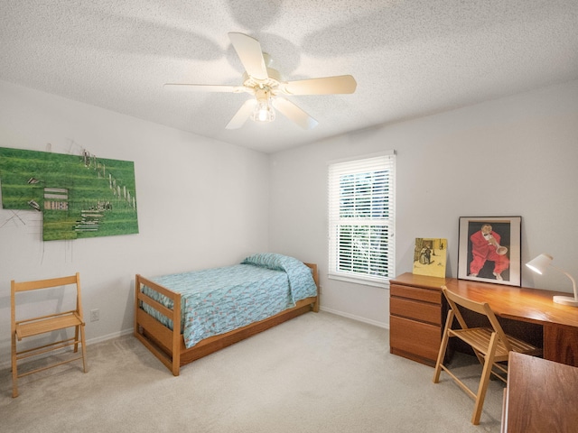 10282 Hunt Club Ln, Palm Beach Gardens, FL 33418 - bedroom featuring light colored carpet, baseboards, a textured ceiling, and ceiling fan