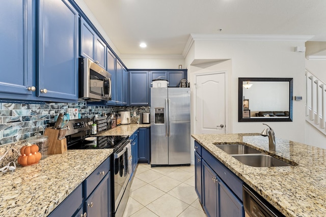 kitchen with blue cabinetry, appliances with stainless steel finishes, ornamental molding, and a sink