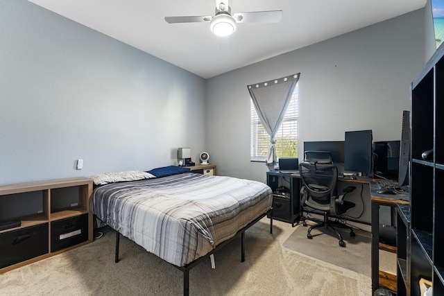 bedroom featuring light carpet and a ceiling fan