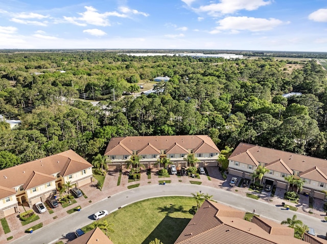 aerial view featuring a residential view and a view of trees