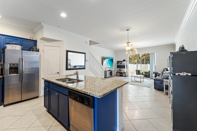 kitchen with light tile patterned floors, a sink, appliances with stainless steel finishes, blue cabinets, and open floor plan