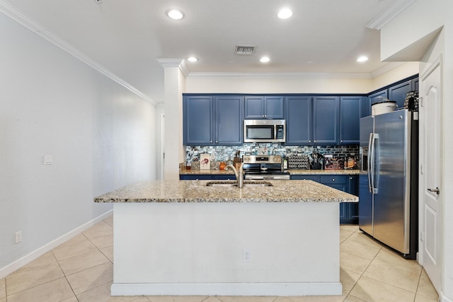 kitchen with blue cabinets, stainless steel appliances, light stone countertops, and visible vents