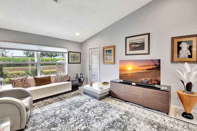 tiled living room with lofted ceiling, a textured ceiling, and baseboards